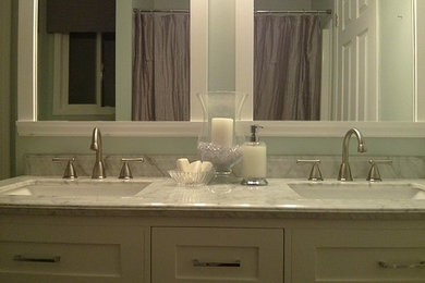 Elegant bathroom photo in Vancouver with an undermount sink, shaker cabinets, white cabinets and marble countertops
