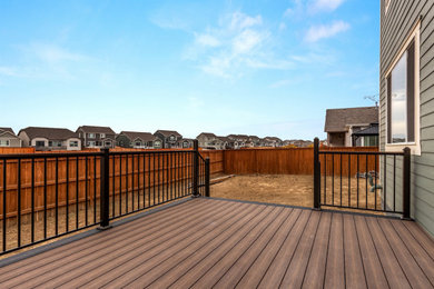 Inspiration for a timeless backyard ground level metal railing deck remodel in Denver with no cover