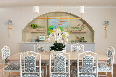 Beach style medium tone wood floor and brown floor dining room photo in Other with beige walls