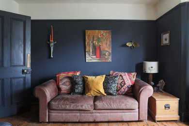 Inspiration for a bohemian living room in Oxfordshire with blue walls.