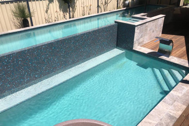 This is an example of a large modern backyard pool in Perth.