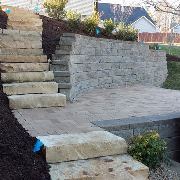 Swimming pool project with retaining walls and patio