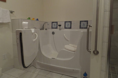 Example of a transitional ceramic tile bathroom design in Other