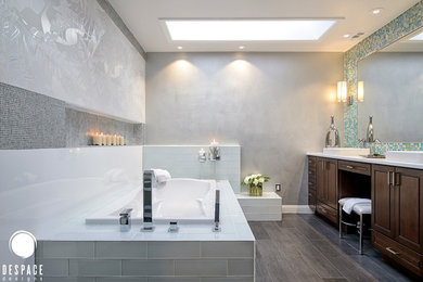 Design ideas for a large contemporary master bathroom in DC Metro with raised-panel cabinets, dark wood cabinets, a drop-in tub, an alcove shower, a two-piece toilet, a vessel sink, grey walls, porcelain floors and engineered quartz benchtops.