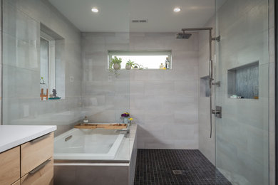 Mid-sized mid-century modern master blue tile and mosaic tile ceramic tile, brown floor and double-sink bathroom photo in Other with flat-panel cabinets, light wood cabinets, gray walls, solid surface countertops, white countertops and a floating vanity