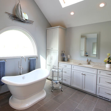 Gray Vanity with Freestanding Tub and Tiled Walkin Shower