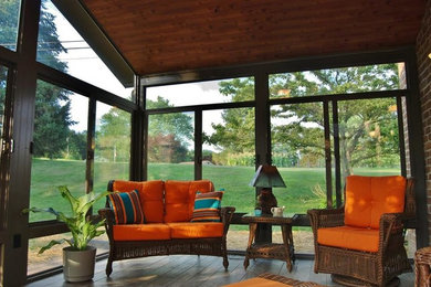 Mid-sized elegant medium tone wood floor sunroom photo in Philadelphia with a standard ceiling