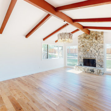 Living room remodeling vaulted ceiling and beams apparents