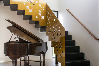Inspiration for a modern staircase remodel in Austin