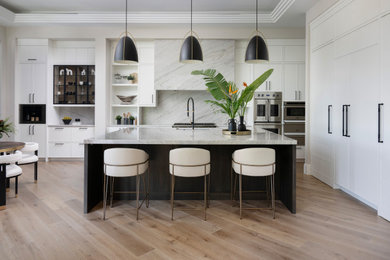 Inspiration for a huge coastal light wood floor eat-in kitchen remodel in Other