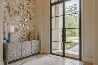 Transitional beige floor entryway photo in Houston with beige walls and a glass front door