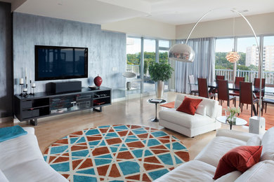 Example of a large trendy formal and open concept light wood floor living room design in New York with a wall-mounted tv, beige walls and no fireplace