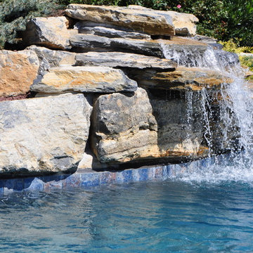 In Ground pool with Boulder Waterfall and Large Spa