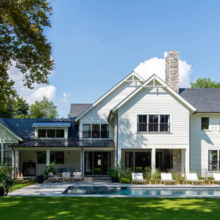 Large country white two-story mixed siding exterior home photo in New York with a shingle roof
