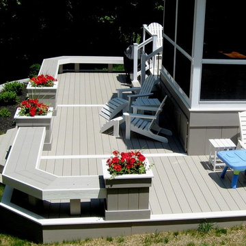 Screened in sunroom with two tier wrap around AZEK deck
