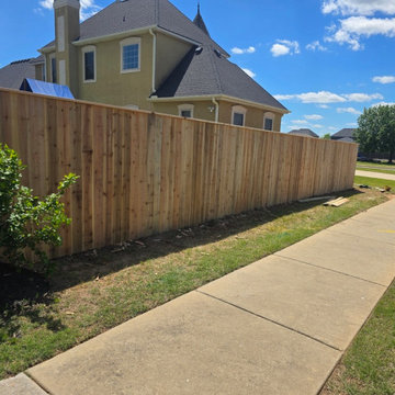 6-Foot Cedar Privacy Fence With Top Cap Installation in Bentonville, AR