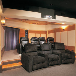 Design ideas for a large traditional enclosed home cinema in Philadelphia with beige walls, carpet and a built-in media unit.