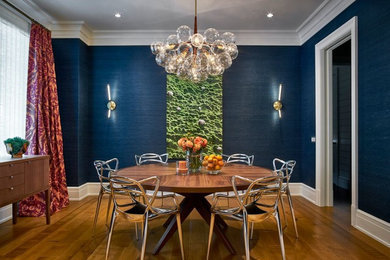 Mid-sized transitional medium tone wood floor and brown floor enclosed dining room photo in New York with blue walls