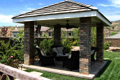 Inspiration for a large traditional backyard landscaping in Orange County.