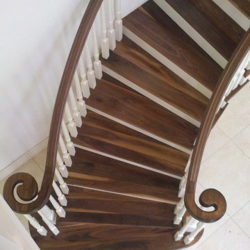 Curved Wallnut and painted continuous handrail