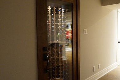 Example of a small classic slate floor wine cellar design in Toronto