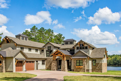 Large rustic green two-story mixed siding exterior home idea in Atlanta with a shingle roof