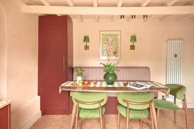 Medium sized contemporary l-shaped kitchen/diner in Other with a built-in sink, flat-panel cabinets, red cabinets, wood worktops, multi-coloured splashback, wood splashback, stainless steel appliances, ceramic flooring, no island, orange floors, multicoloured worktops, exposed beams and a chimney breast.