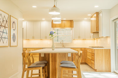 Example of a mid-sized 1950s l-shaped porcelain tile and green floor enclosed kitchen design in Other with an undermount sink, flat-panel cabinets, medium tone wood cabinets, quartz countertops, white backsplash, porcelain backsplash, stainless steel appliances, an island and white countertops