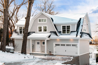 Mid-sized beach style gray two-story vinyl exterior home photo in Minneapolis with a shingle roof and a black roof