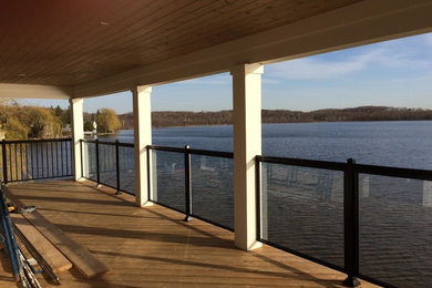 Photo of a contemporary side yard deck in Other.