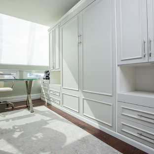 Small modern home studio in Vancouver with green walls, medium hardwood flooring and a freestanding desk.