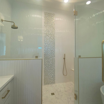 Stunning Bathroom with wavy tiles and penny round mosaic