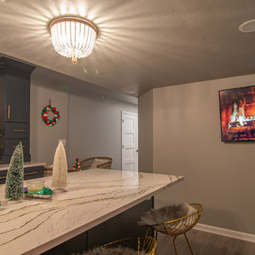 Basement Utilizing Open Space to Shoot Pool and Watch Favorite Sports Team