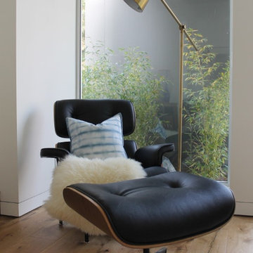 Eames Chair and Ottoman with Brass Floor Lamp and Sheepskin