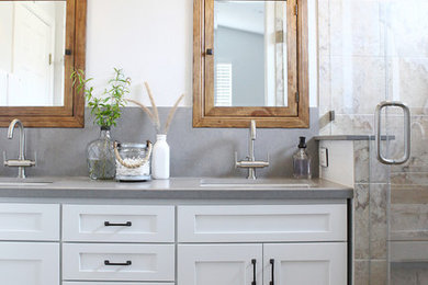 Inspiration for a mid-sized transitional bathroom in San Francisco with an undermount sink, shaker cabinets, white cabinets, engineered quartz benchtops, an alcove shower, a two-piece toilet, gray tile, porcelain tile, grey walls and porcelain floors.