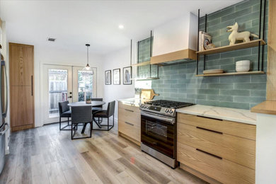Mid-sized 1960s galley vinyl floor and beige floor eat-in kitchen photo in San Diego with an undermount sink, flat-panel cabinets, light wood cabinets, quartz countertops, green backsplash, porcelain backsplash, stainless steel appliances, no island and white countertops