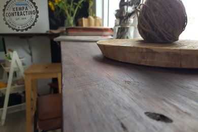 Inspiration for a rustic home bar in Perth with wood worktops.