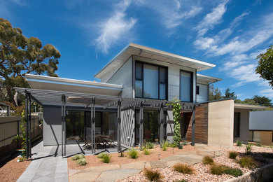 Mid-sized contemporary two-storey house exterior in Adelaide with metal siding.