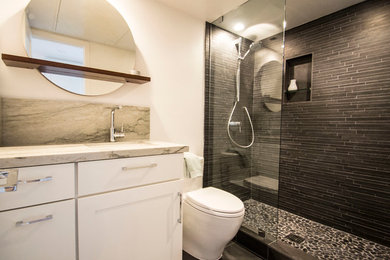 Trendy black tile bathroom photo in San Diego