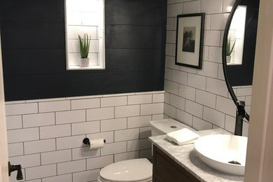 Inspiration for a small cottage white tile and porcelain tile limestone floor, gray floor, single-sink and shiplap wall bathroom remodel in Dallas with furniture-like cabinets, light wood cabinets, a two-piece toilet, blue walls, a vessel sink, marble countertops, gray countertops, a niche and a freestanding vanity
