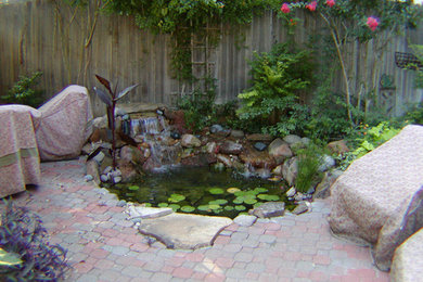 Inspiration for a mid-sized full sun backyard brick outdoor basketball/tennis/multi-game court in Dallas.