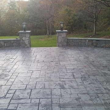 T-Stamped concrete patio, flagstone wall with columns