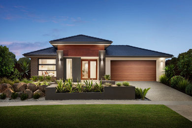 This is an example of a mid-sized contemporary home design in Melbourne.