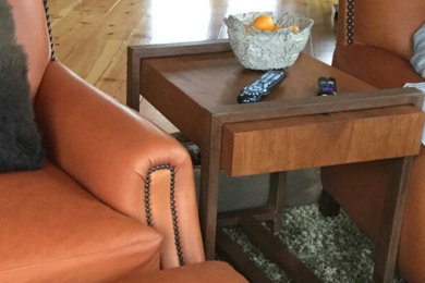 Inspiration for a mid-sized rustic open concept light wood floor living room remodel in Orange County with beige walls and a wall-mounted tv