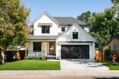 Cottage white two-story board and batten house exterior photo in Denver with a shingle roof and a black roof
