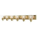Livex Lighting - Antique Brass Transitional, Colonial, Vanity Sconce - Bring a beautiful new look to your bathroom or vanity area with this charming extra-large six-light vanity sconce from the Birmingham collection. A wide rectangular antique brass finish back plate supports six simple graceful arms that hold six hand blown clear glass shades.  The clean lines of this updated classic will make this piece an appealing part of your home.