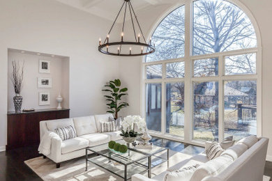 Inspiration for a large transitional formal and open concept dark wood floor, brown floor and coffered ceiling living room remodel in Kansas City with gray walls and no tv
