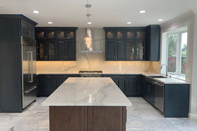 Eat-in kitchen - mid-sized craftsman u-shaped ceramic tile and gray floor eat-in kitchen idea in San Francisco with a farmhouse sink, shaker cabinets, blue cabinets, marble countertops, white backsplash, marble backsplash, stainless steel appliances, an island and white countertops