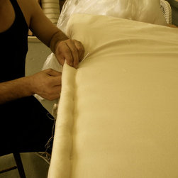 Mattress edge cushion being stitched - Furniture