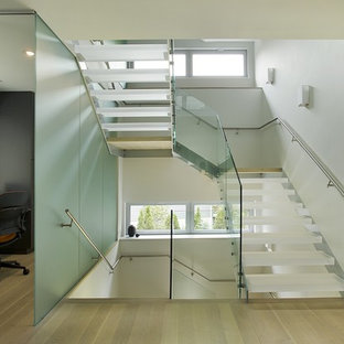 Design ideas for a medium sized modern acrylic u-shaped staircase in Boston with open risers.